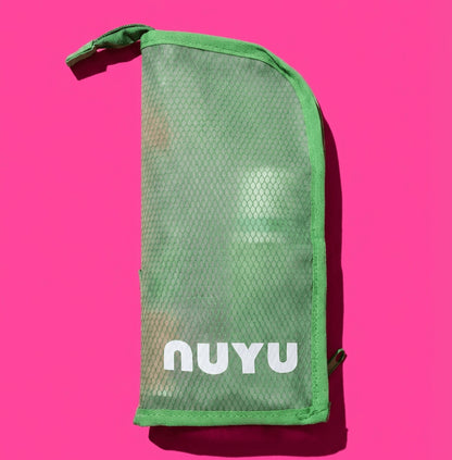 Green Nuyu travel pouch on pink background