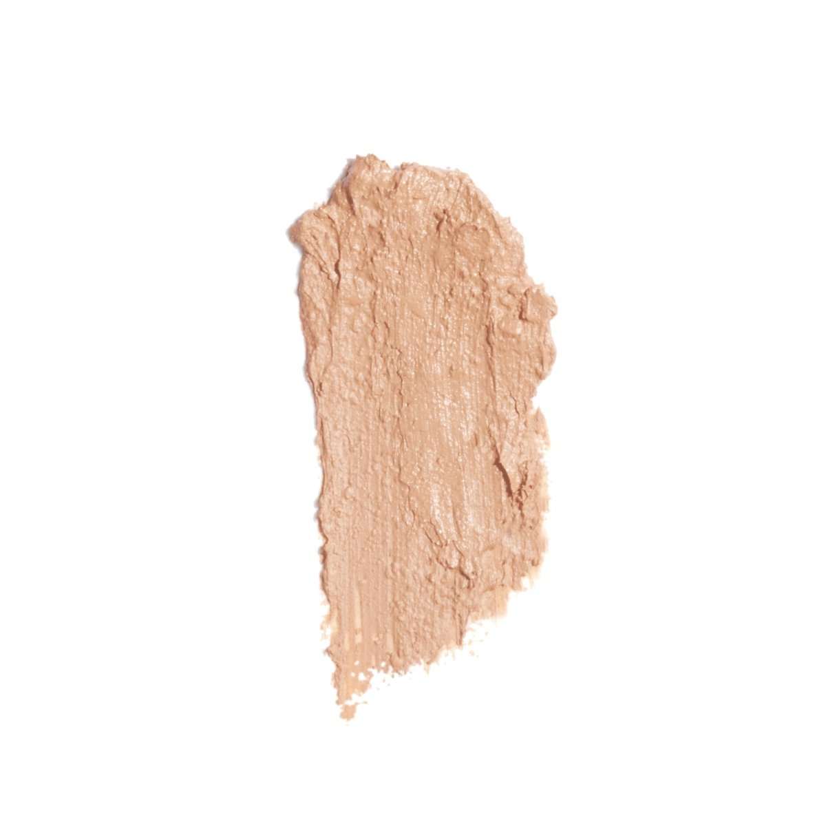 smudge of ATTITUDE PHYTO-Sun plastic-free mini solid tinted oil SPF 30 tinted sunscreen for face with natural ingredients and zinc oxide