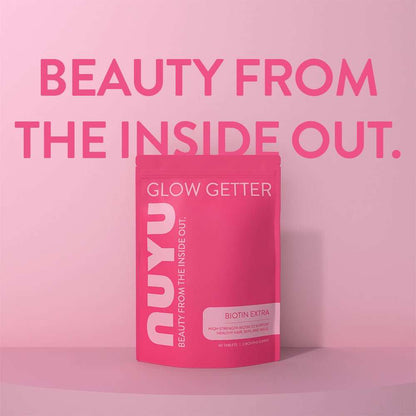 NUYU BIOTIN EXTRA pink packaging on gradient background promoting hair skin and nail support UK
