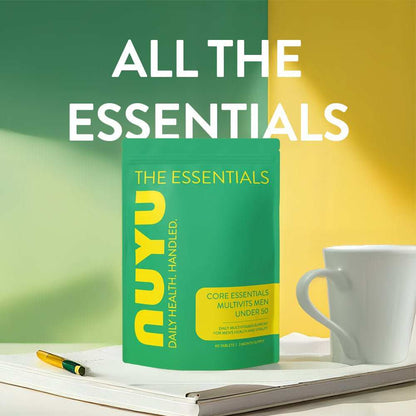NUYU men's daily vitamins green package on white tray with coffee cup and pen