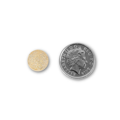 NUYU multivitamin supplement UK tablet size comparison with British 5p coin