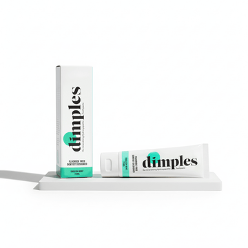 NUYU Dimples remineralising toothpaste tube with box, white packaging with teal accents, wellness supplement UK