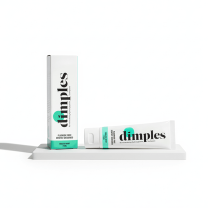 NUYU Dimples remineralising toothpaste tube with box, white packaging with teal accents, wellness supplement UK