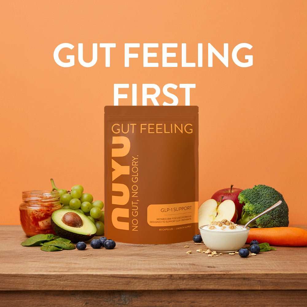 NUYU gut health supplement UK with fresh fruits vegetables and oats on wooden surface