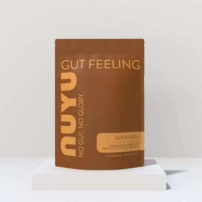 NUYU Gut Biotic+ probiotic support supplement in brown packaging on white platform