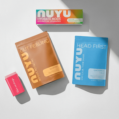 NUYU gut health supplement UK bundle with colorful packaging on white surface