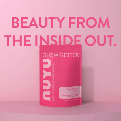 NUYU Hyaluronic Acid+ wellness supplement UK in pink packaging on gradient background