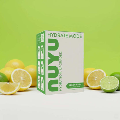 NUYU HYDRATE MODE electrolyte sachets UK lemon lime box with fresh citrus fruits