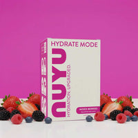 Hydrate Mode Mixed Berry electrolyte drink sachets with zero sugar and bold berry flavor surrounded by fresh mixed berries