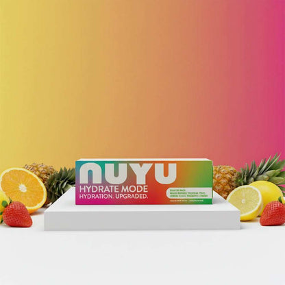 NUYU Hydrate Mode sampler pack with tropical fruits on white surface, daily electrolytes UK