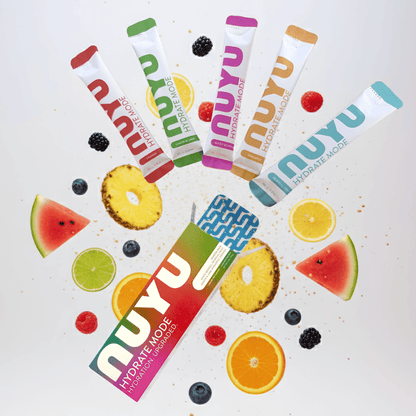 NUYU hydration electrolyte sachets UK arranged in colorful fan with fresh fruit slices