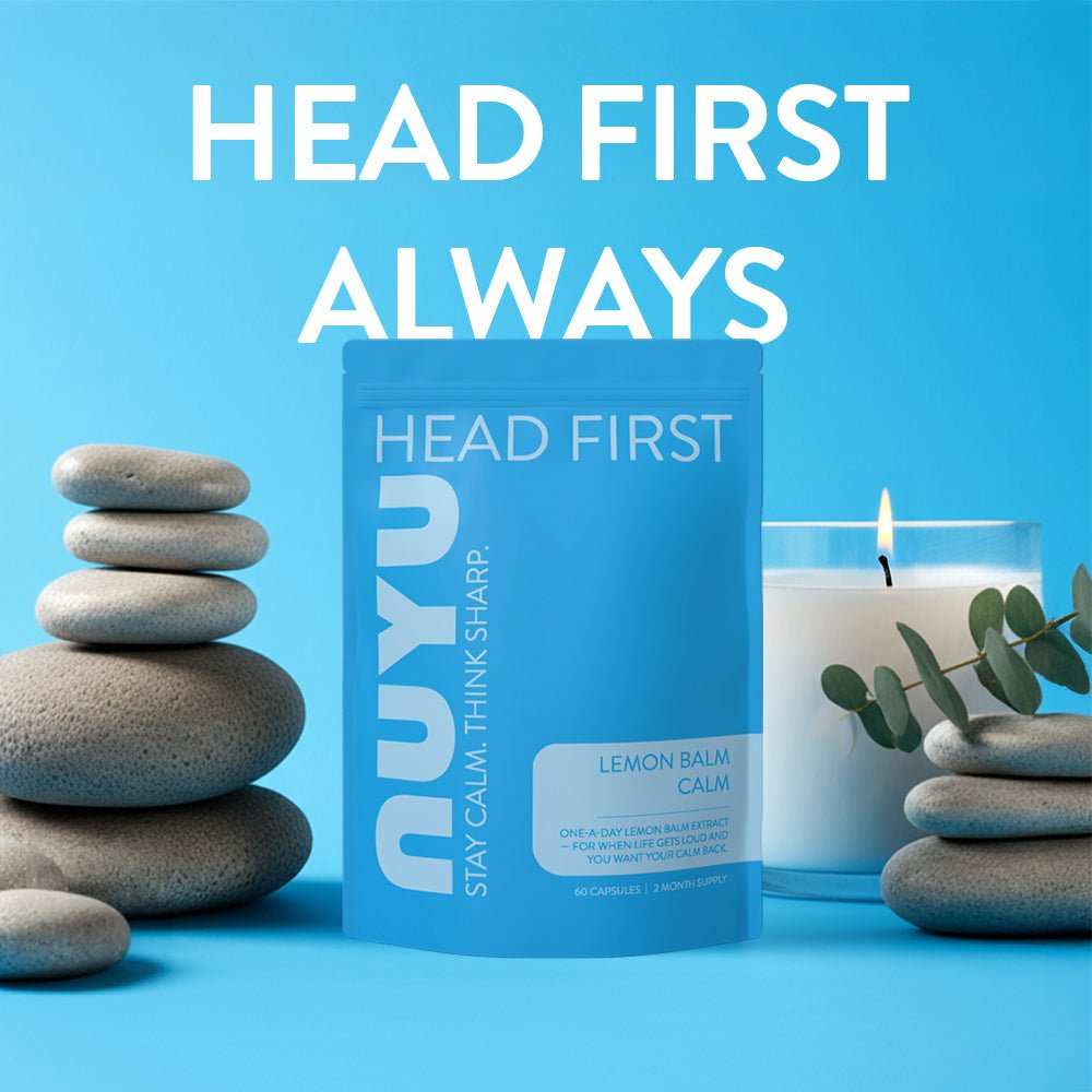 NUYU magnesium sleep spray UK blue packaging with stacked zen stones and eucalyptus branch
