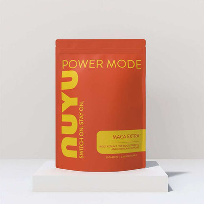 NUYU Maca Extra Power Mode wellness supplement UK in orange pouch on white platform