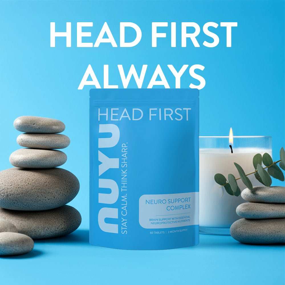 NUYU Neuro Support Complex wellness supplement UK with stacked stones and eucalyptus on blue background