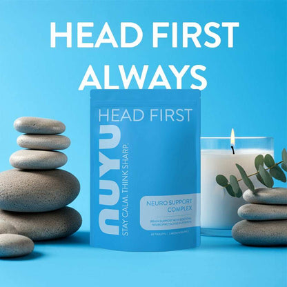 NUYU Neuro Support Complex wellness supplement UK with stacked stones and eucalyptus on blue background
