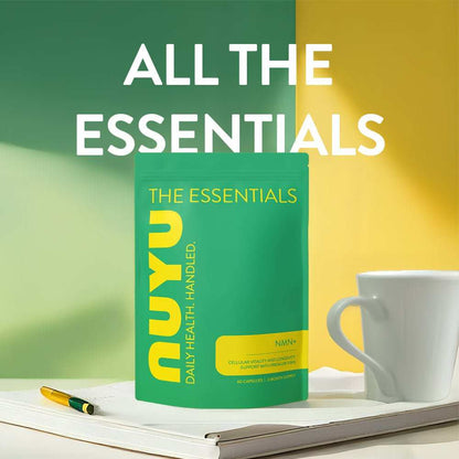 NUYU NMN supplement UK green packaging on white tray with coffee cup and pen