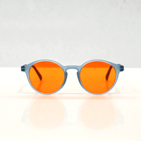 NUYU Afterlight blue light blocking glasses UK with orange lenses and grey frame on white