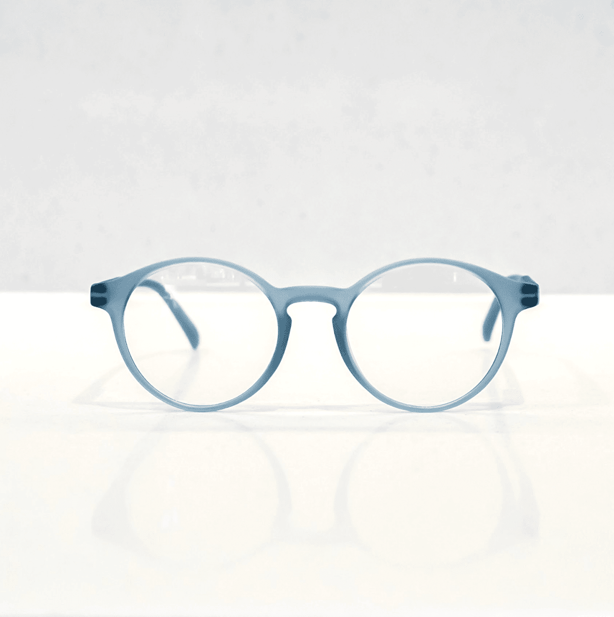NUYU Afterlight blue light blocking glasses UK in translucent blue frame on white background