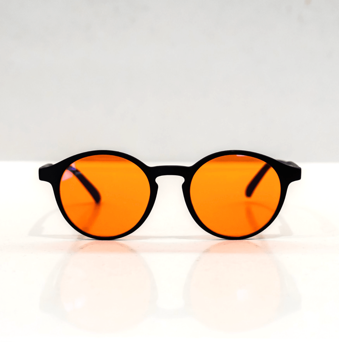 NUYU Afterlight blue light blocking glasses UK with orange lenses and black frames