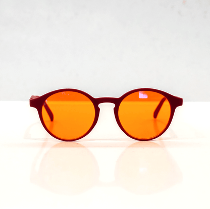 NUYU Afterlight blue light blocking glasses UK with orange lenses and burgundy frames on white