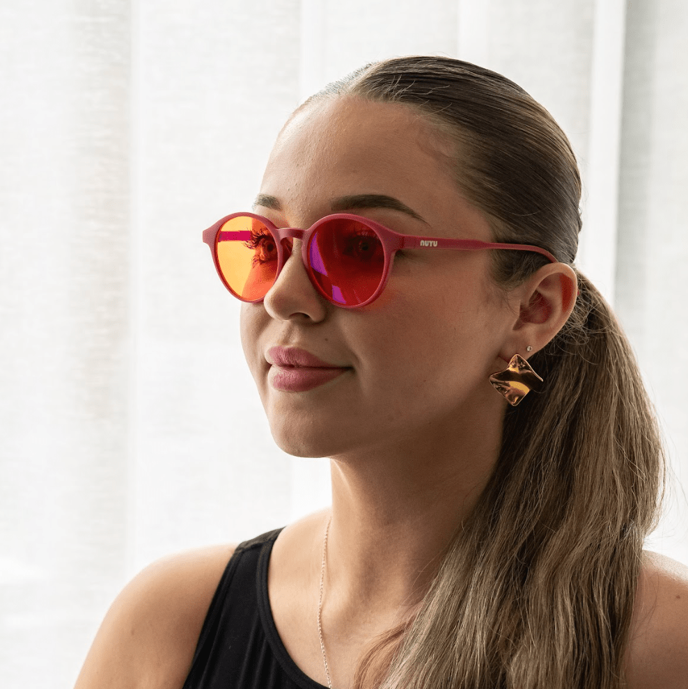 NUYU Afterlight blue light blocking glasses UK styled on woman with gold earrings