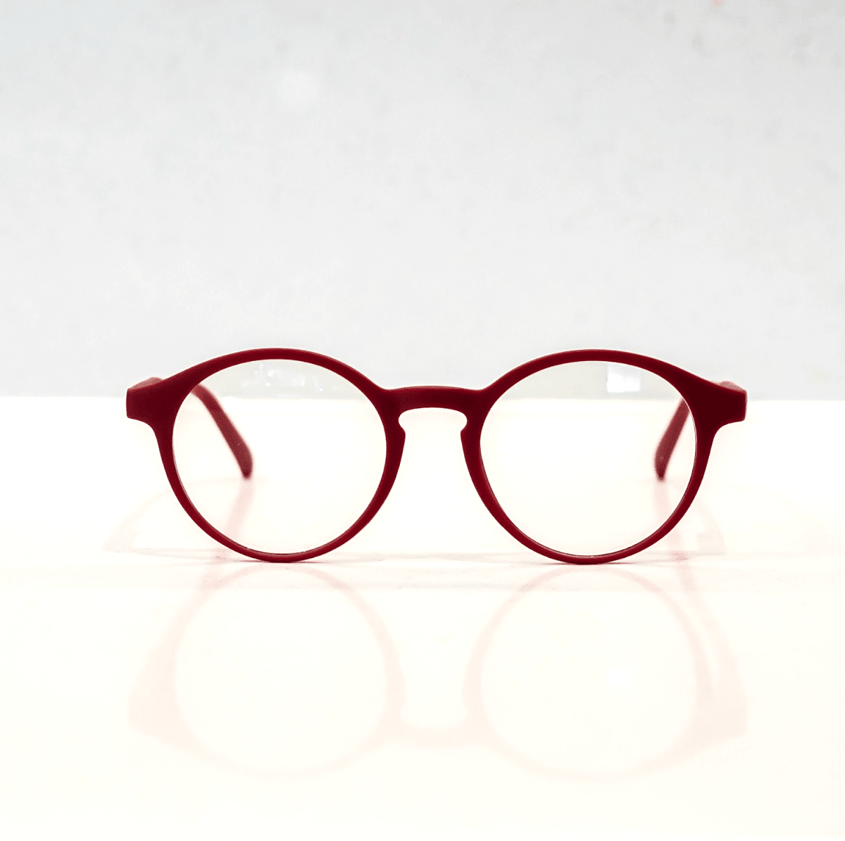 NUYU Afterlight blue light blocking glasses UK in burgundy red round frame on white background