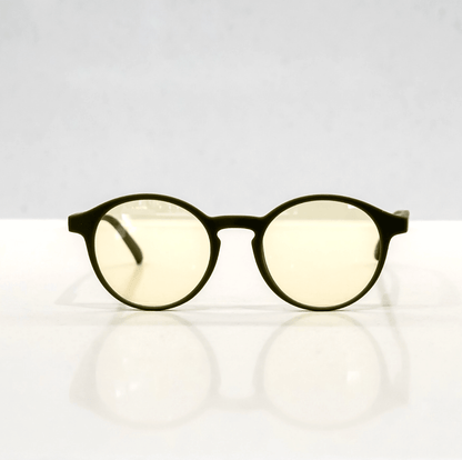 NUYU Afterlight blue light blocking glasses UK with yellow tinted lenses on white surface
