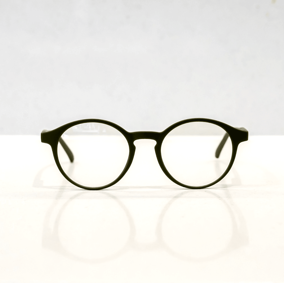 NUYU Afterlight blue light blocking glasses UK round black frames front view on white
