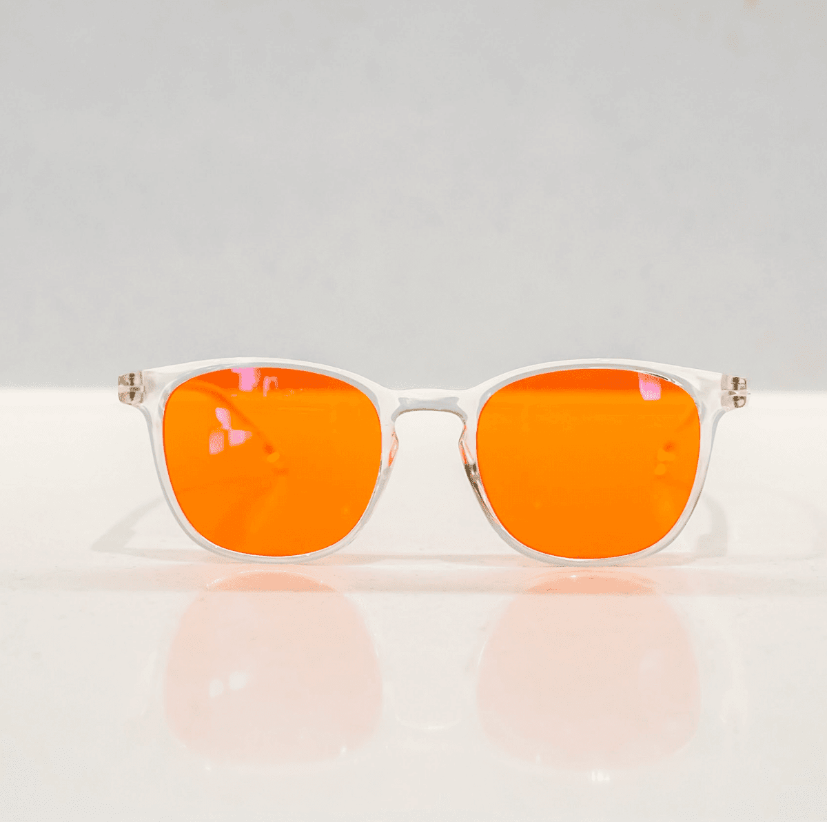 NUYU Afterlight blue light blocking glasses UK with clear frames and orange lenses
