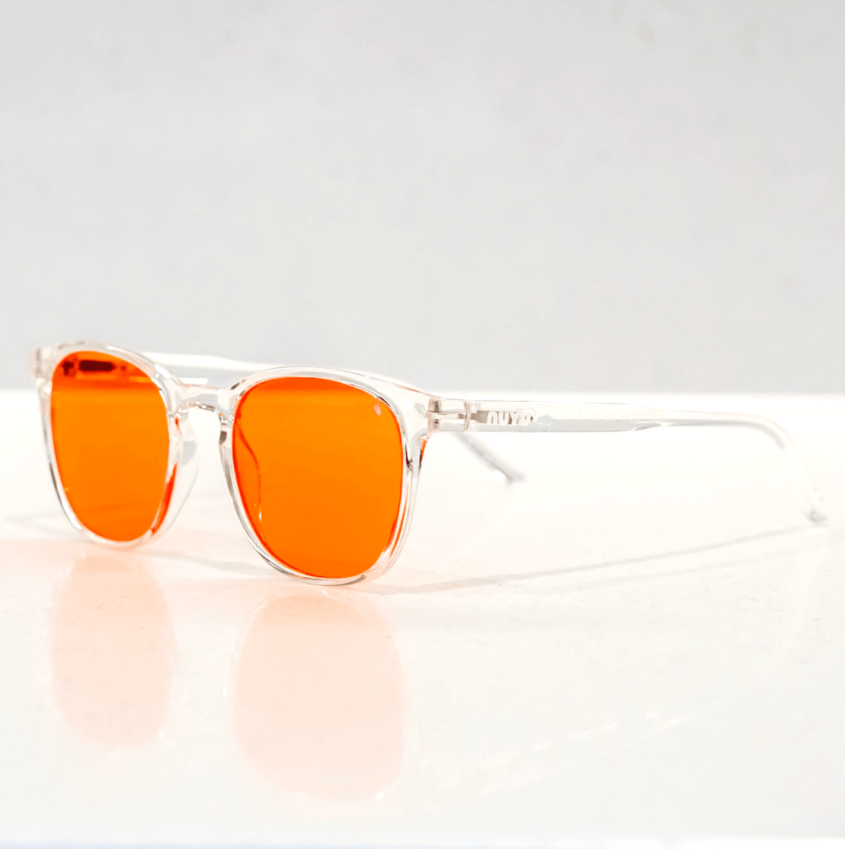 NUYU Afterlight blue light blocking glasses UK with clear frames and orange lenses