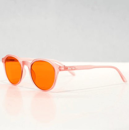 NUYU Afterlight blue light blocking glasses UK with orange lenses and pink frames