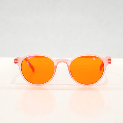 NUYU Afterlight blue light blocking glasses UK with pink frames and orange lenses front view
