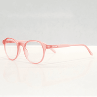 NUYU Afterlight blue light blocking glasses UK in translucent pink frames on white background