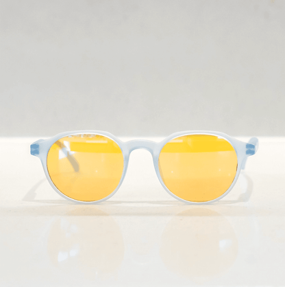 NUYU Afterlight blue light blocking glasses UK with yellow lenses on white surface