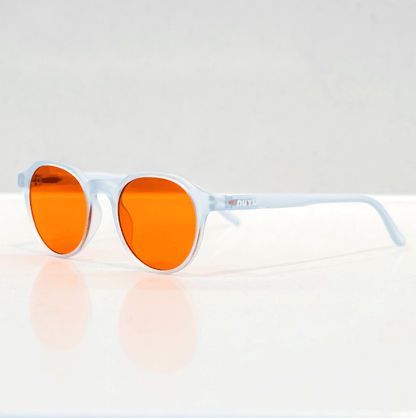 NUYU Afterlight blue light blocking glasses UK with clear frames and orange lenses on white