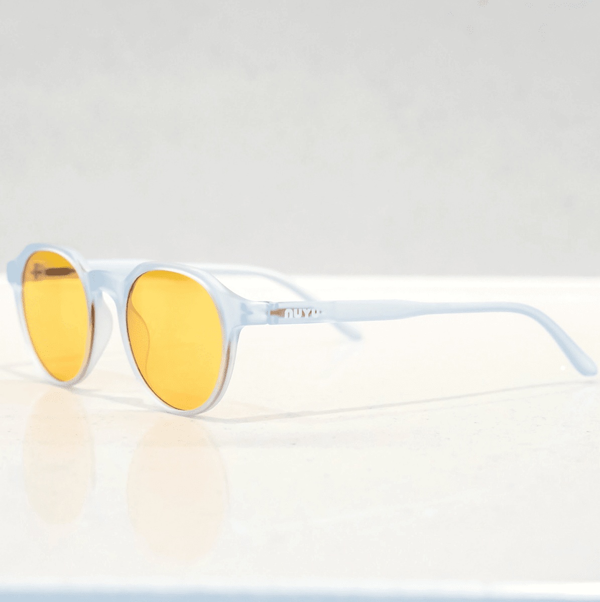 NUYU Afterlight blue light blocking glasses UK with clear frame and yellow lenses, side view