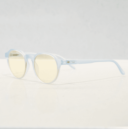 NUYU Afterlight blue light blocking glasses UK in translucent light blue frame with yellow lenses