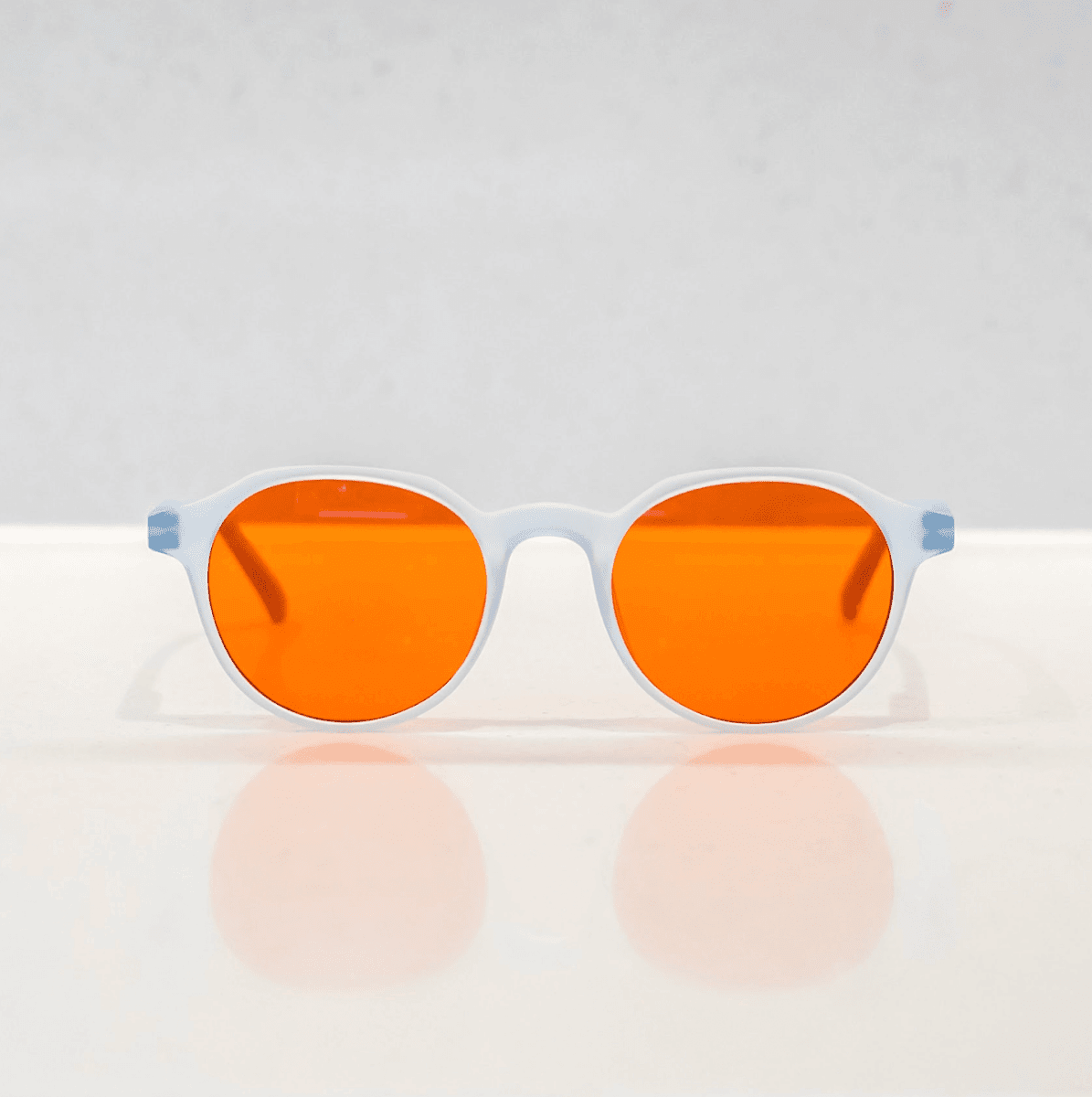 NUYU Afterlight blue light blocking glasses UK with orange lenses and clear frame
