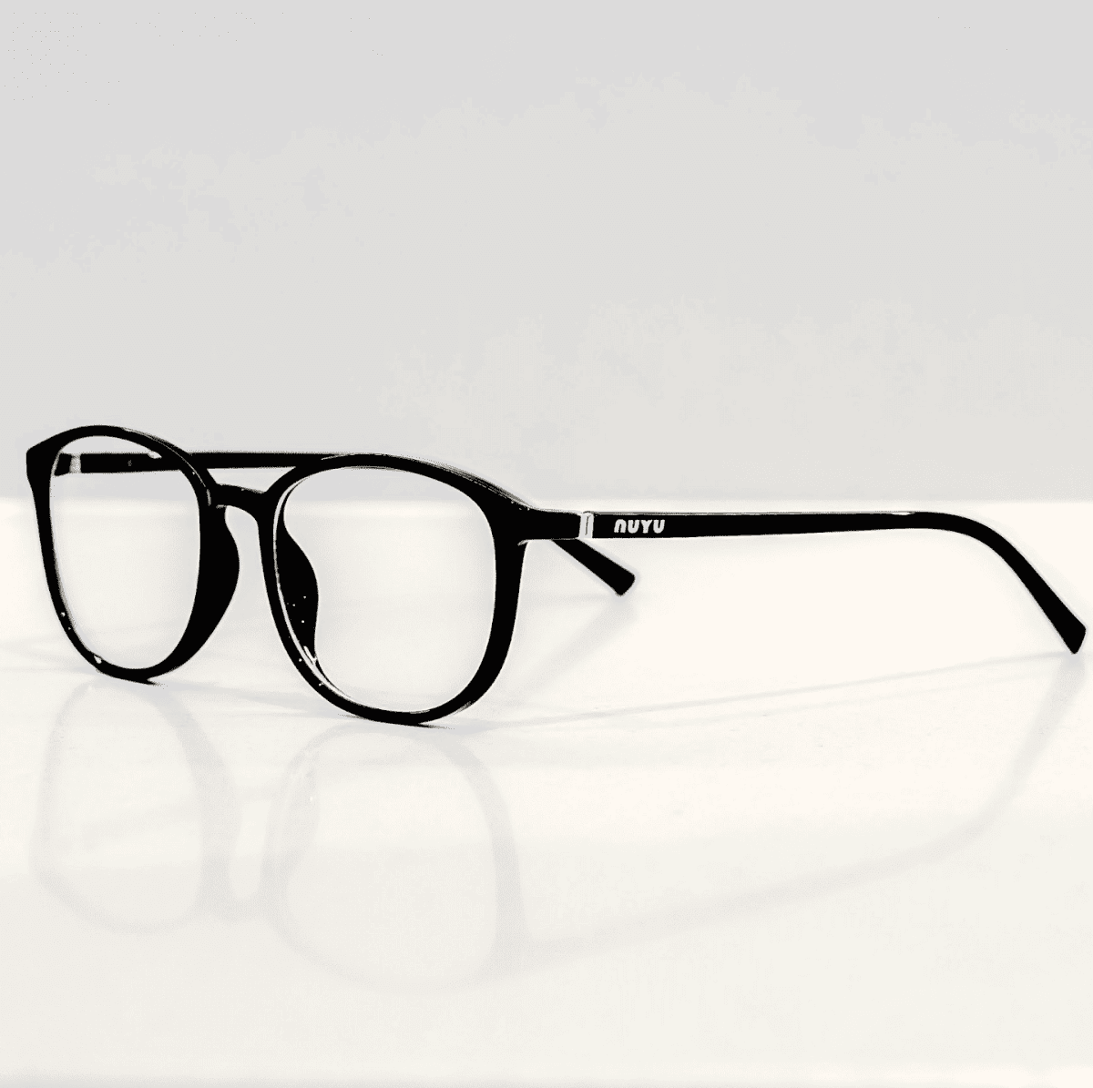 NUYU Afterlight blue light blocking glasses UK shown in sleek black frame on white surface