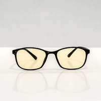 NUYU Afterlight blue light blocking glasses UK with yellow tinted lenses on white surface