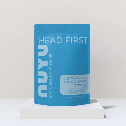 NUYU ashwagandha supplement UK blue pouch on white platform minimalist setting