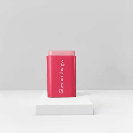 Red reusable NUYU Pocket Pack pouch with "Glow on the go" text for carrying supplements on the go