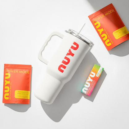 NUYU wellness supplement UK bundle with white tumbler and vibrant orange packaging