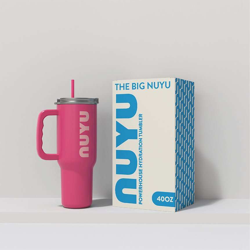NUYU pink tumbler with straw beside blue branded packaging box for wellness supplement UK