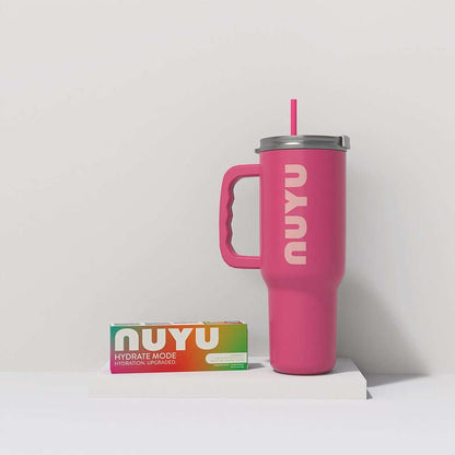NUYU pink tumbler with straw and colorful hydration bundle box on white shelf - wellness supplement UK