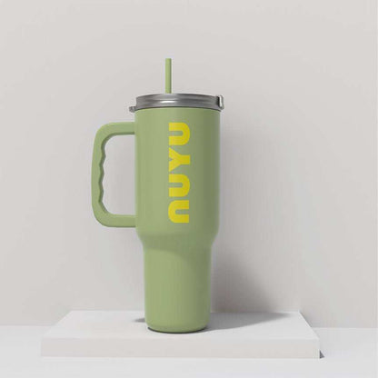 NUYU green insulated tumbler UK with yellow logo and straw on white surface