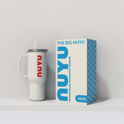NUYU Big Nuyu white insulated tumbler UK with straw next to blue product packaging box