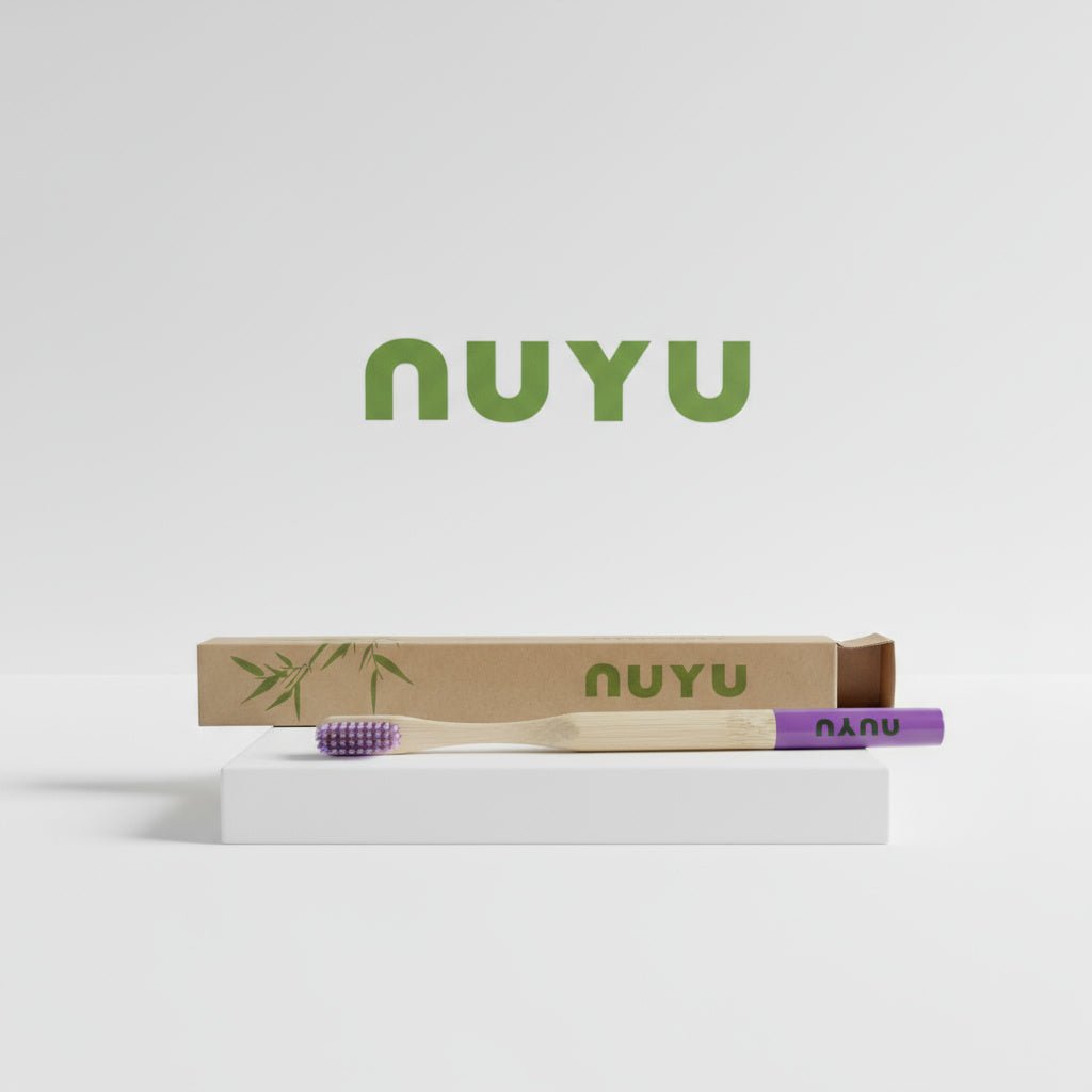 NUYU Happy Toothbrush with purple bristles and eco packaging from UK wellness supplement brand