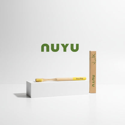 NUYU Happy Toothbrush with yellow bristles and kraft packaging, wellness supplement UK brand