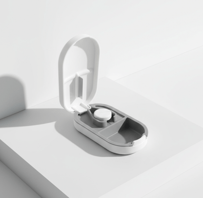 NUYU Slice pill cutter open case showing precision blade, wellness supplement UK cutting tool